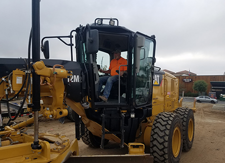 Photo Of An Edmondson Construction CAT 12M2 Blade Garding A Jobsite